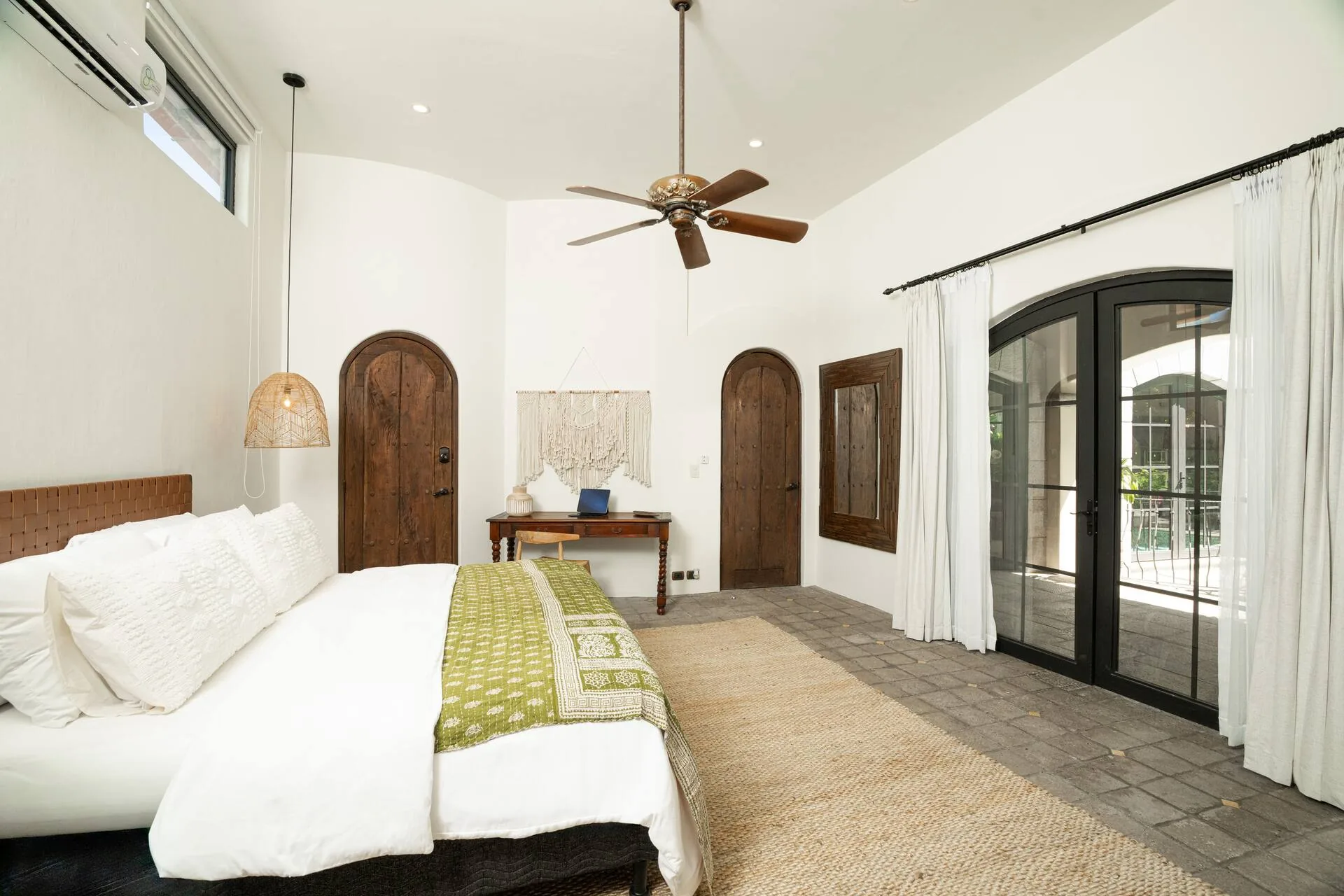 Bedroom with king bed and indigo bedspread