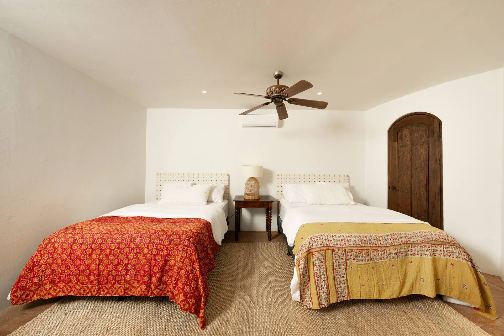 Bedroom 4 — two queen beds with red and yellow bedspreads